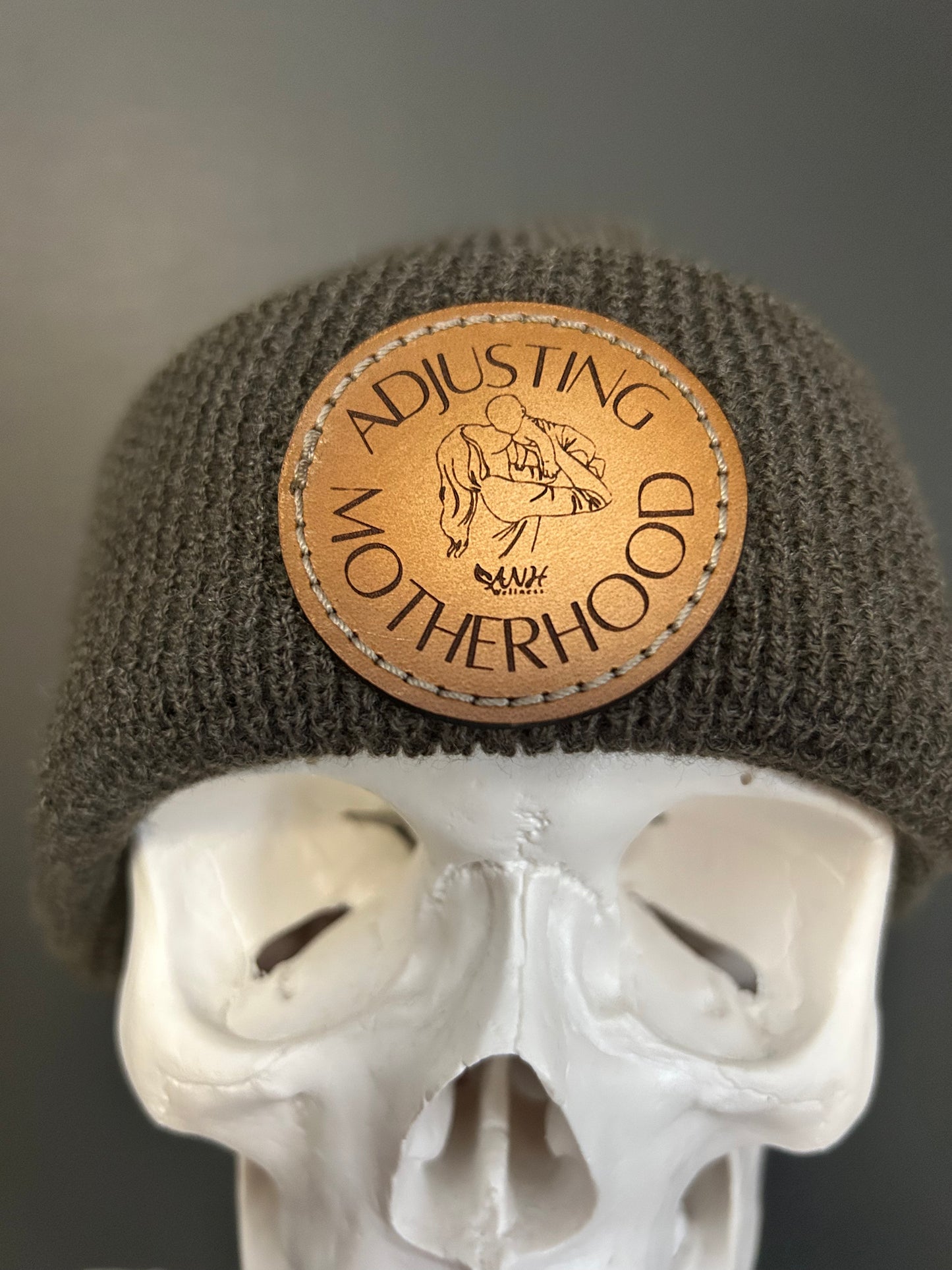 Adjusting Motherhood Knit Beanie